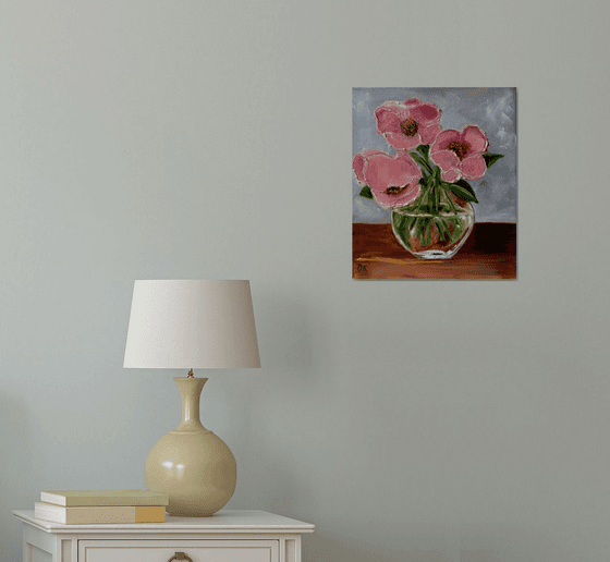 Bouquet of wild coral roses in a vase.