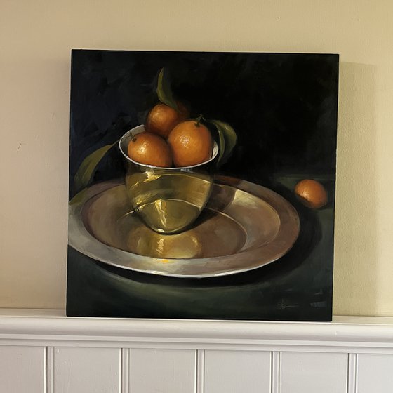 Kumquats in a gold bowl