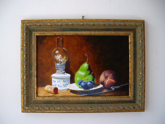 Oil lamp with fruits