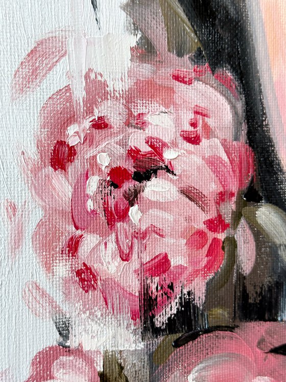 Asian woman with pink peonies