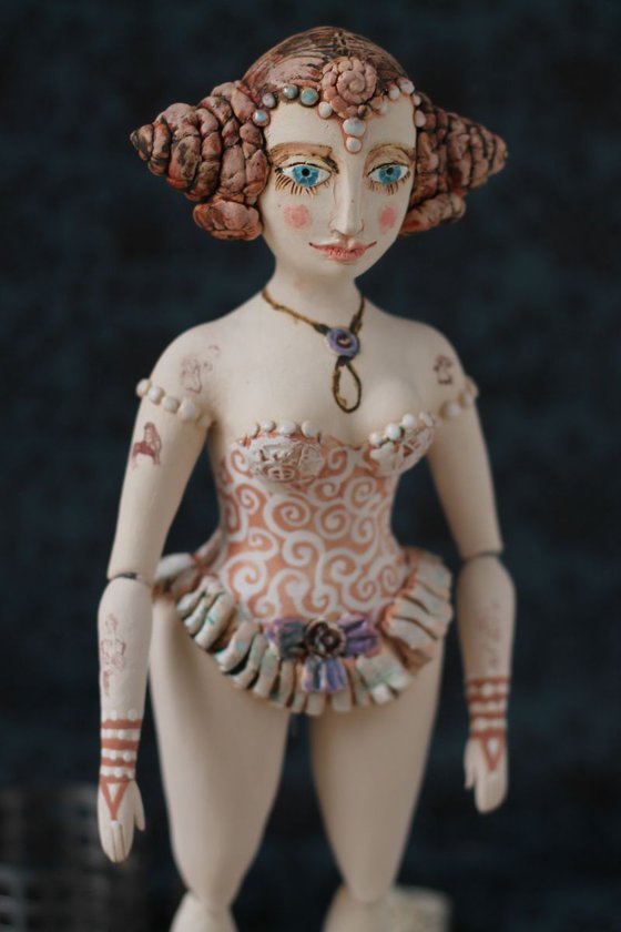 From the Naked clay series, Girl with chignon double bun. Wall sculpture by Elya Yalonetski