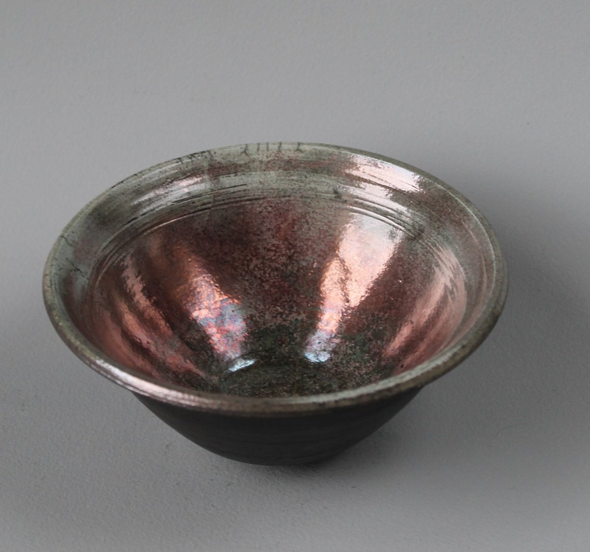 Raku Bowl with Open Rim and Turquoise Lustre. by Monique Robben- Andy Sheppard