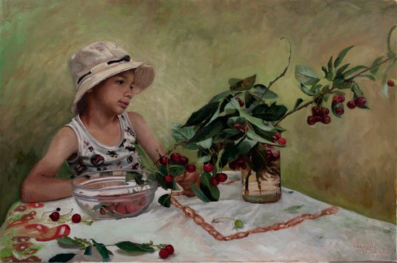 Young boy with cherries