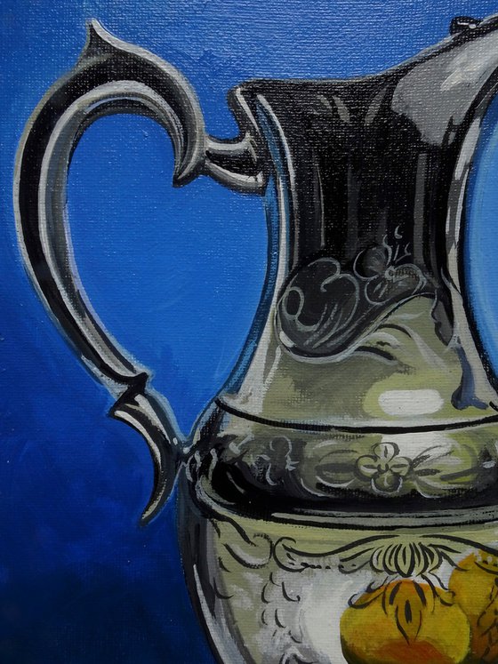 Still life water jug and lemons