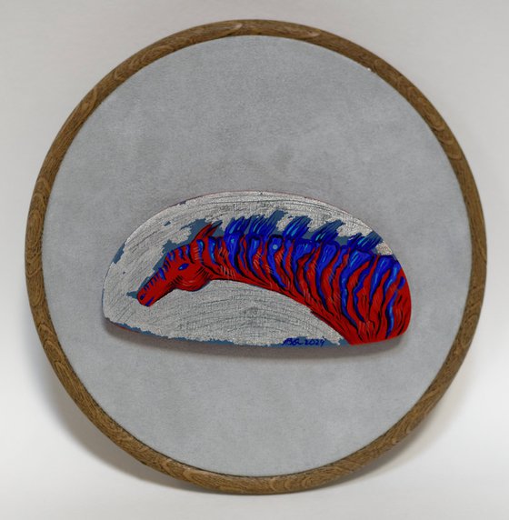 Red zebra on a silver
