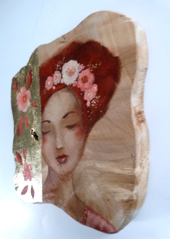 Tender dreams.Portrait of a dreamy woman on wood, teak piece