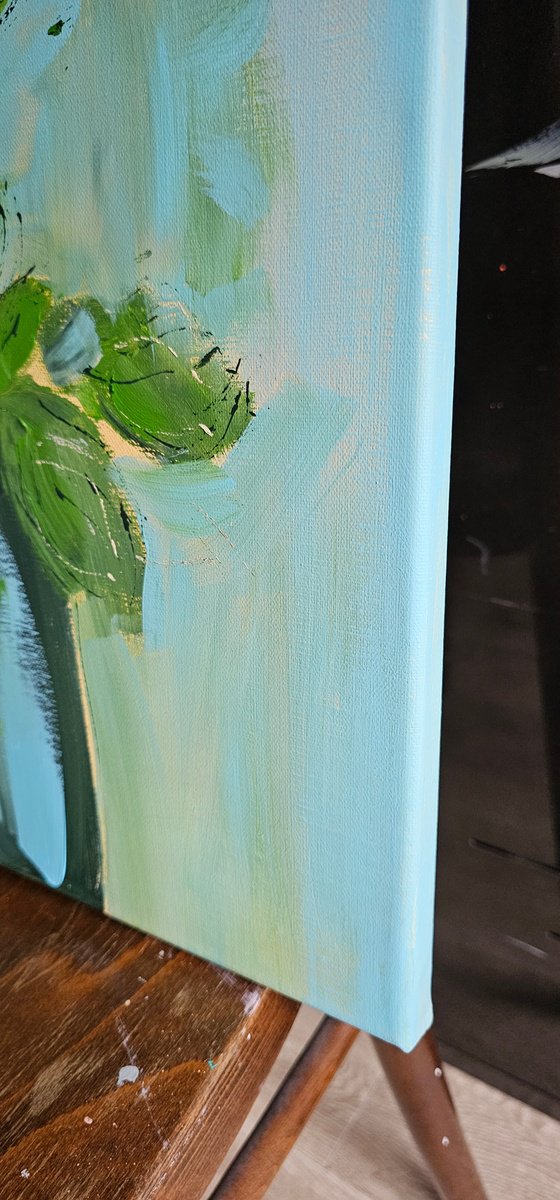 Yellow roses in a pot on blue