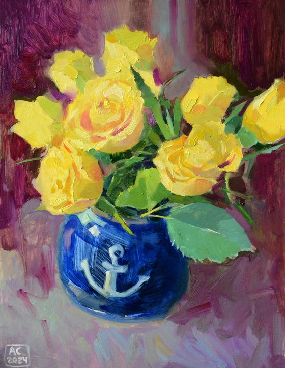 Yellow tulips in a blue vase on a purple background