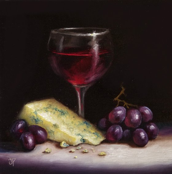 Red wine with cheese and grapes still life