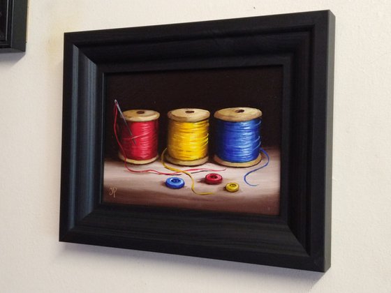 Three cotton reels