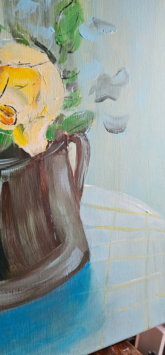 Blooming yellow roses on blue