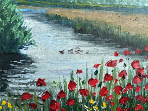 Red poppies by the water. Pleinair painting