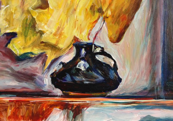 Black vase with autumn leaves