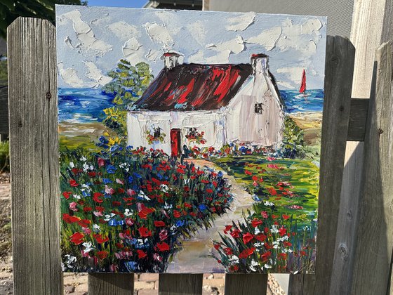 Old house with red flowers