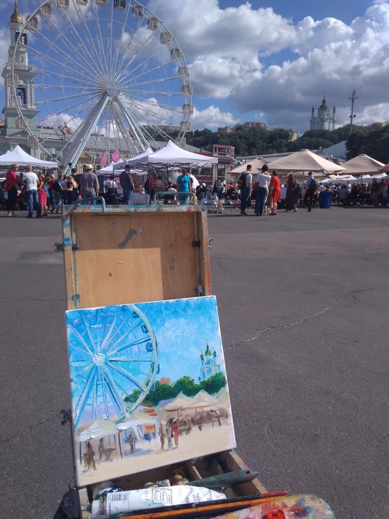 City square with a Ferris wheel and the city festival. Pleinair painting