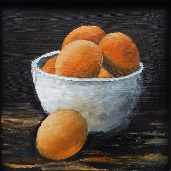 Eggs in a bowl. Small framed painting.