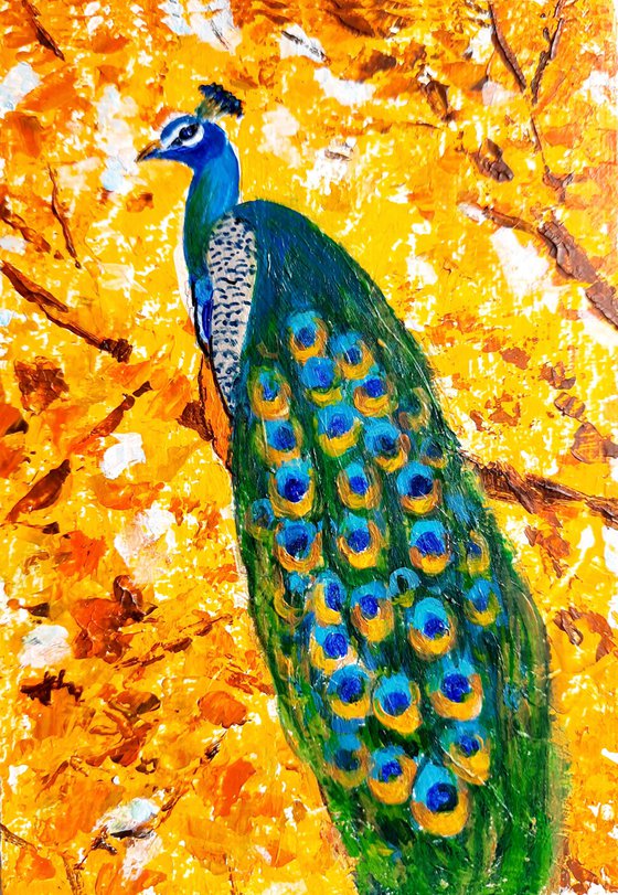 Peacock on the Golden Autumn tree