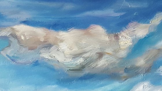 Clouds dance across the big blue sky towards the horizon - semi abstract seascape