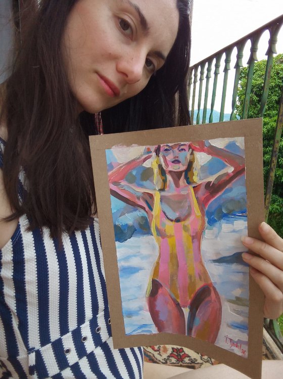 Girl in a Striped Swimsuit On the beach