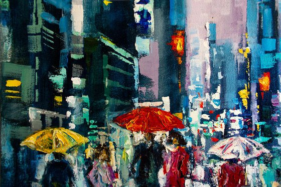 "Night city lights" ,  people with umbrellas