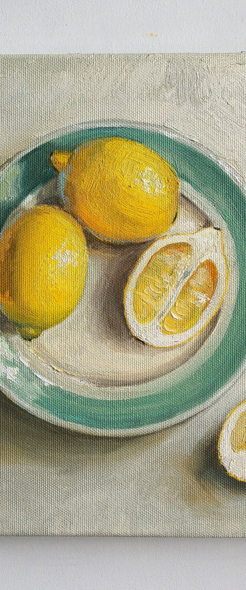 Lemons on plate by Leyla Demir