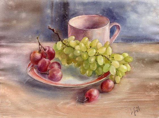 Still life with grapes on a plate and a cup on the table