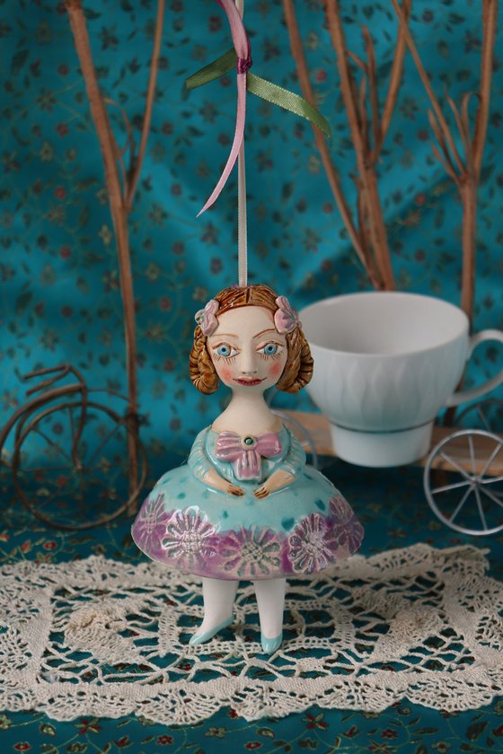 Little Girl in Mint Blue Dress. Tiny hanging sculpture