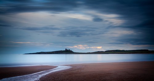 Dunstanburgh Castle from beach by DAVID SLADE