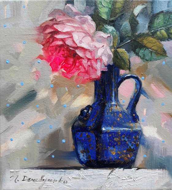Rose in a blue vase