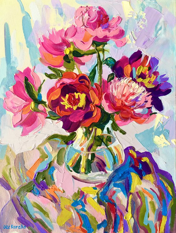 Bright peonies in a glass vase