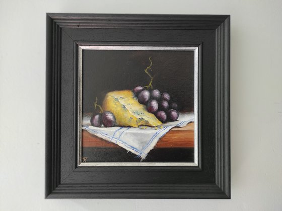 Cheese and grapes still life