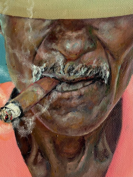 Smoking man in a hat