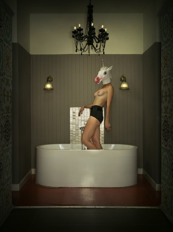Portrait of a unicorn woman in the bathroom
