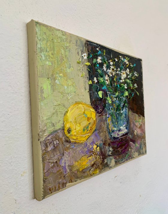 Still life with wildflowers and a lemon