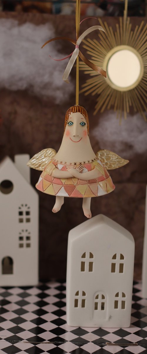 Tiny hanging sculpture by Elya Yalonetski. Smiling Angel by Elya Yalonetski