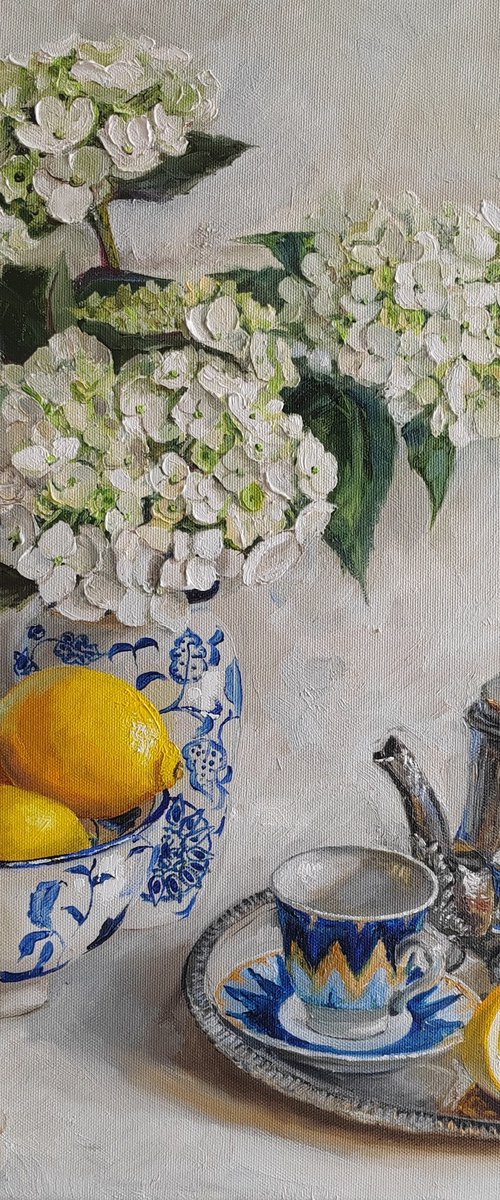White hudrangea flower bouquet in porcelian vase with Antique Metal Teapot by Leyla Demir