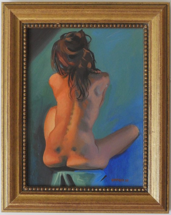 Nude seated back view