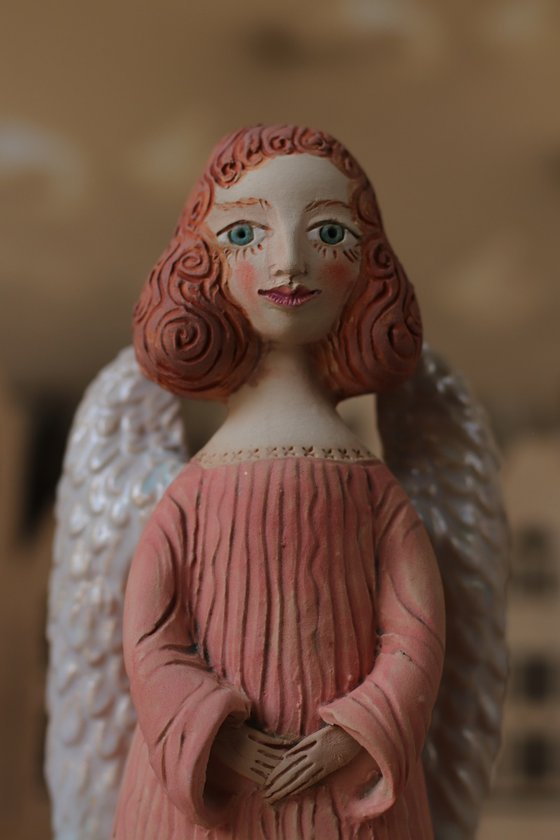 Angels all around me. Angel of hope. Ceramic sculpture