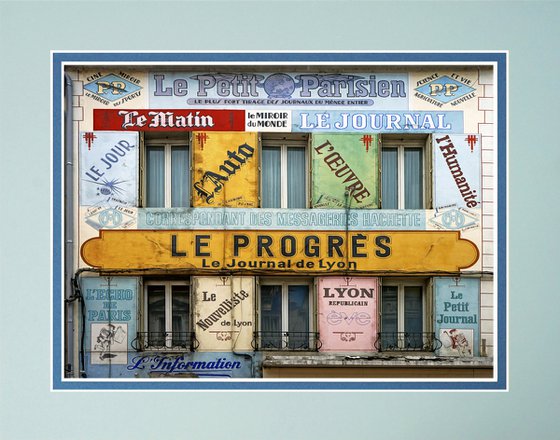 Vintage building advertising newspapers France