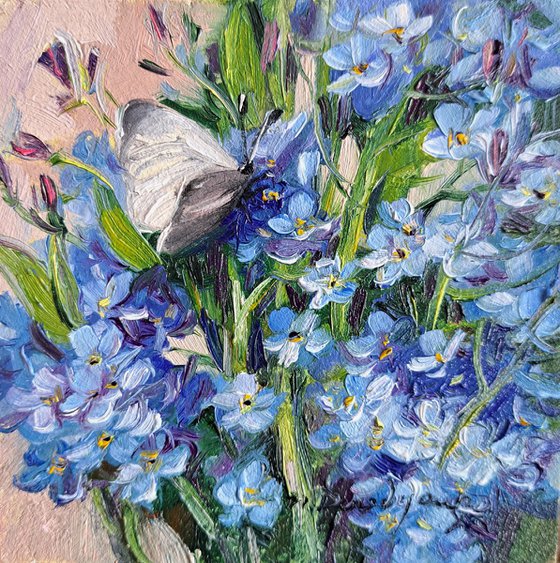 Forget-me-not flowers with butterfly
