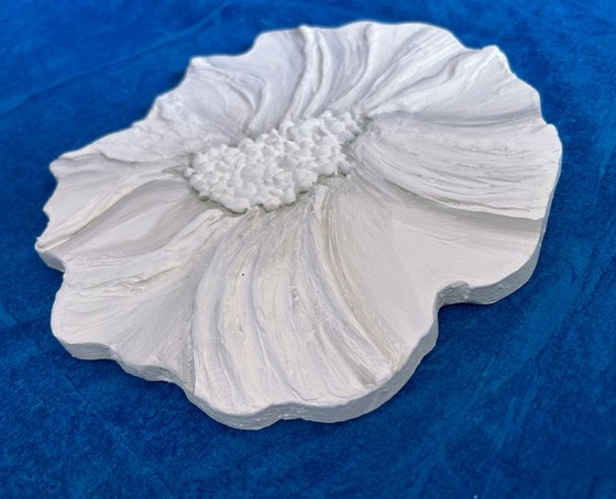 Small white sculptured  flower