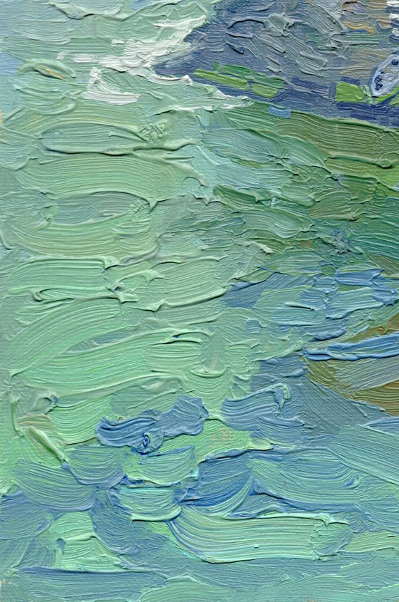 A lonely white sail gleams