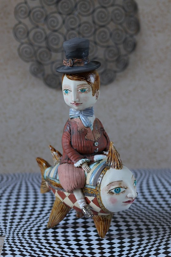 Vintage dressed boy riding the fish. From "Le Carousel, Hommage à l'Innocence" project by Elya Yalonetski