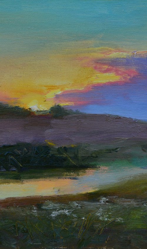 “Sunset over a calm river” by Andriy Berekelia