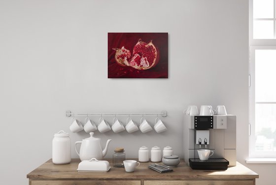 Ripe pomegranate with seeds still life