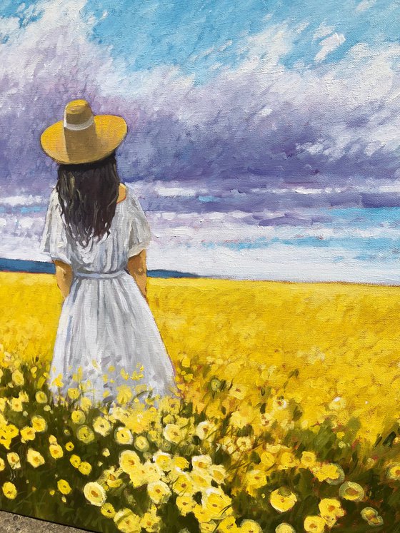 Summer. Woman in flower field