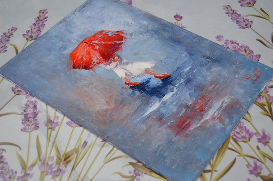 A girl running through puddles