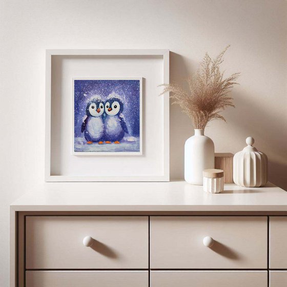 Two penguins painting