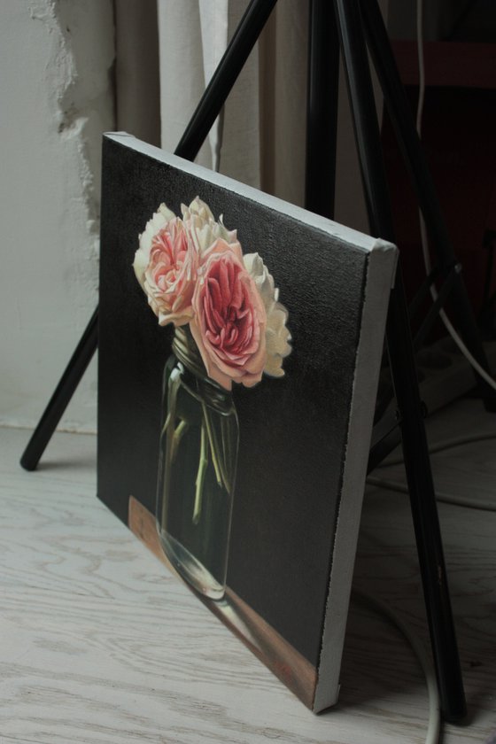 small bouquet of roses on a black background