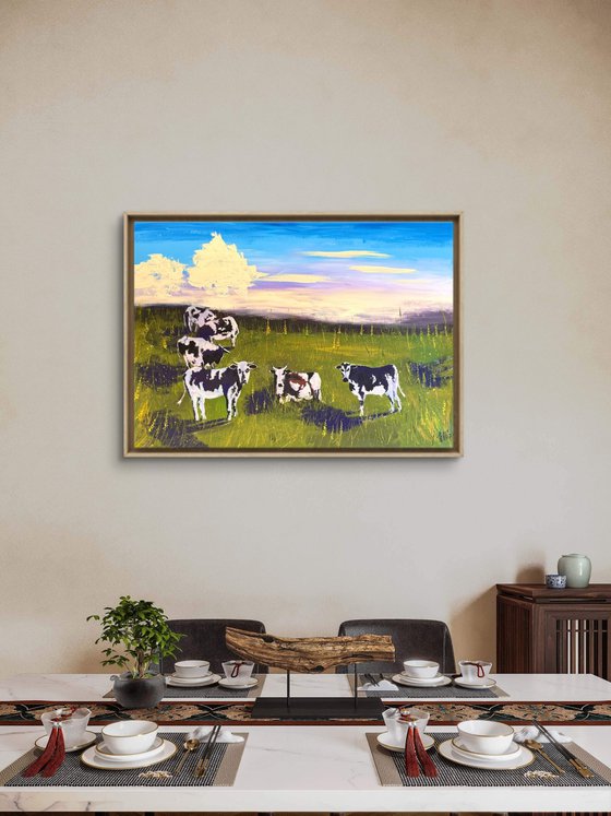 Cows grazing in the field